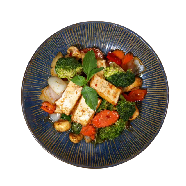 Basil tofu stir-fry with broccoli, mushrooms, bell pepper, carrot and Thai basil