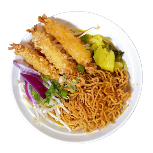 Tempura Khao Soi — shrimp tempura over Northern Thai curry broth with crispy egg noodles and pickled greens