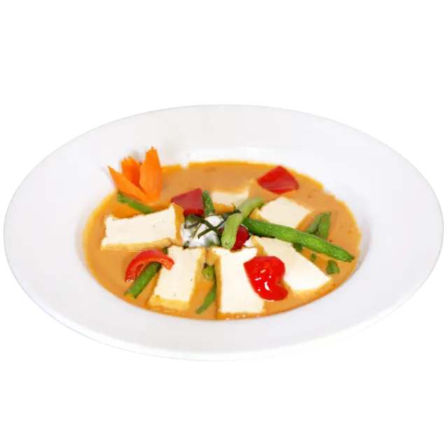 Panang curry with tofu, green beans, red bell pepper and kaffir lime leaf in thick coconut curry sauce