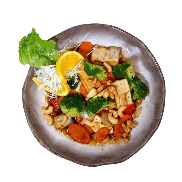 Cashew nut stir-fry with tofu, broccoli, carrot, bell pepper and roasted cashews