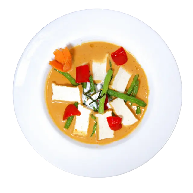 Panang curry with tofu, green beans and red bell pepper in thick coconut curry